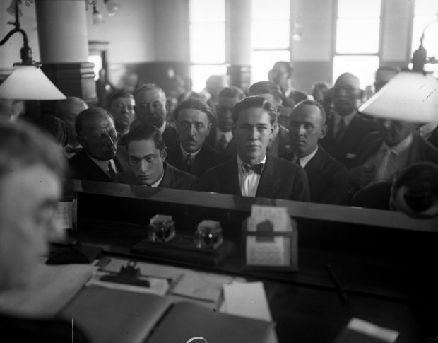 Nathan Leopold Jr., left, and Richard Loeb, center, plead guilty before Judge John R. Caverly in Chicago in 1924. (Chicago Tribune historical photo)