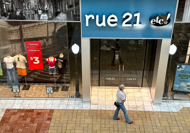 A shopper walks by a rue21 store at Solano Town Center on May 3, 2024 in Fairfield, California. Pittsburgh-based teen fashion retailer rue21 filed for Chapter 11 bankruptcy and plans to close all of its 540 stores in the coming weeks. (Justin Sullivan/Getty)