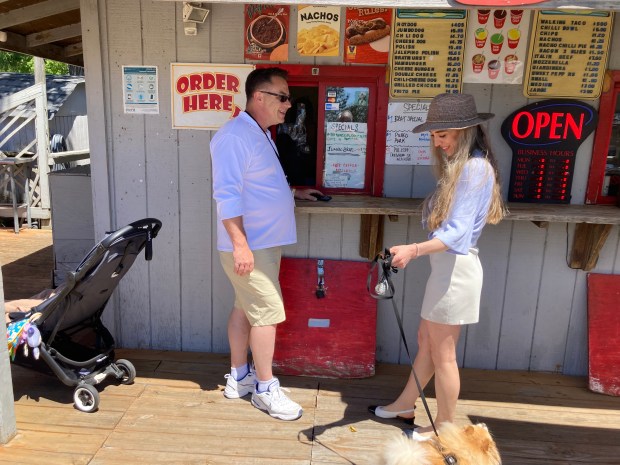 Quentin and Olga Marx of Lake Forest order a meal at Dockside Dogs in Waukegan. (Steve Sadin/Lake County News-Sun)