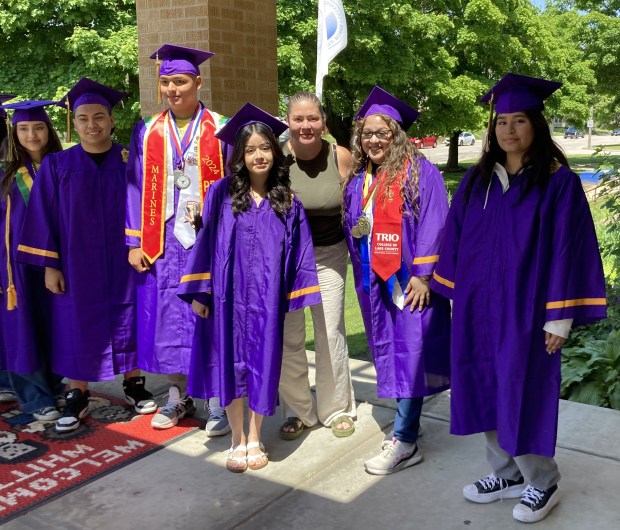 Superintendent Theresa Plascencia, fifth from left, congratulates Waukegan High School seniors at Whittier Elementary School during the first-annual Return to My Roots event. (Steve Sadin/Lake County News-Sun)