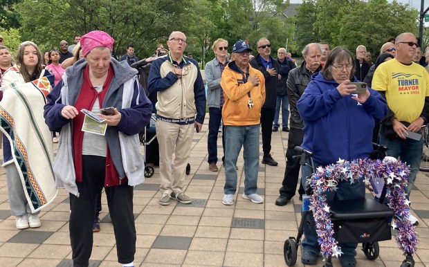 Members of the crowd at Waukegan's Memorial Day ceremony formed a chorus as the national anthem was sung. (Steve Sadin/Lake County News-Sun)