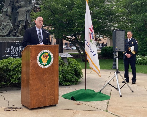 Skokie Fire Chief Jeff Hoeflich, at right, introduced Rabbi Moshe Wolf at Skokie's Memorial Day ceremony Monday.