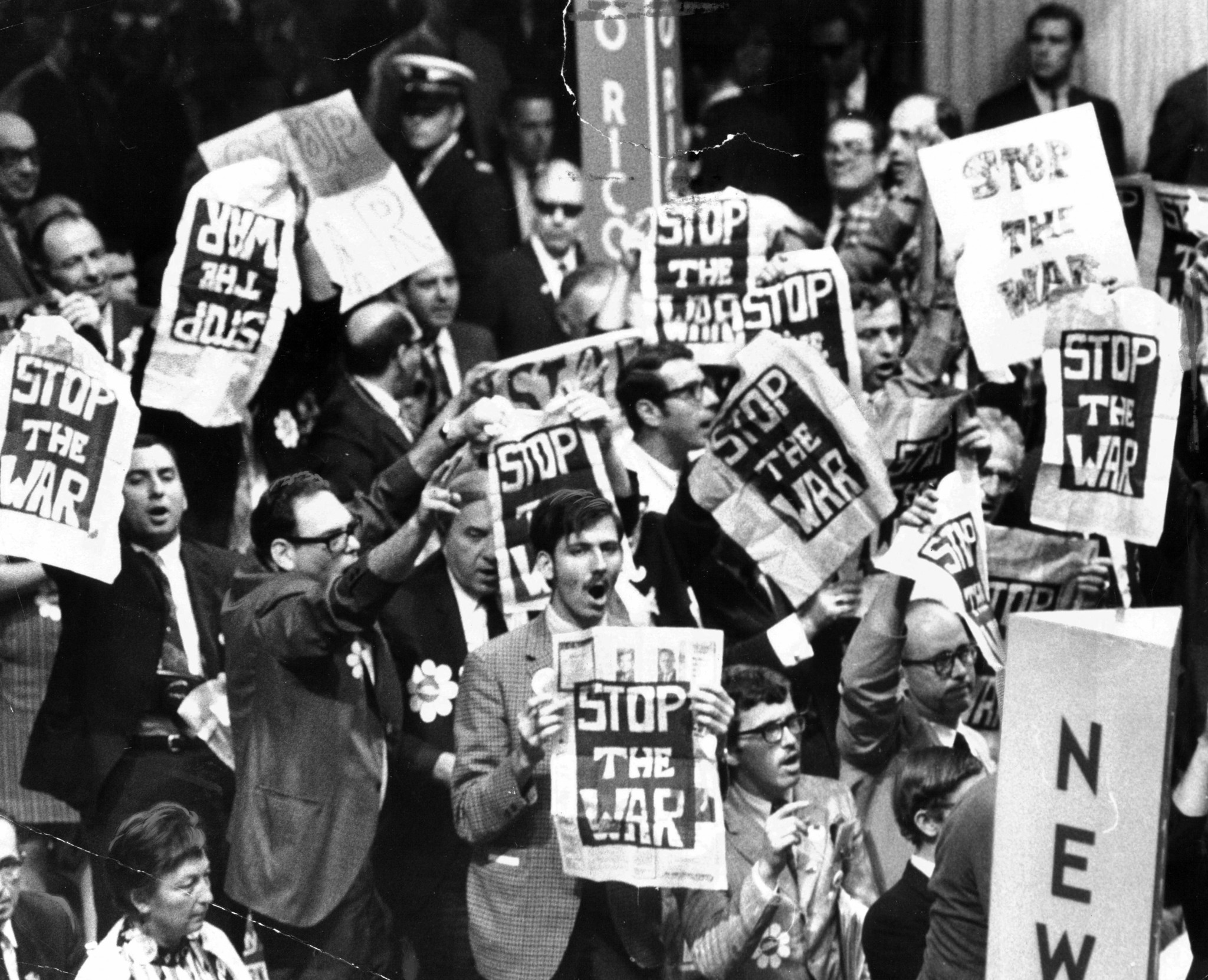 Delegates on the Democratic National Convention floor chant "Stop the...