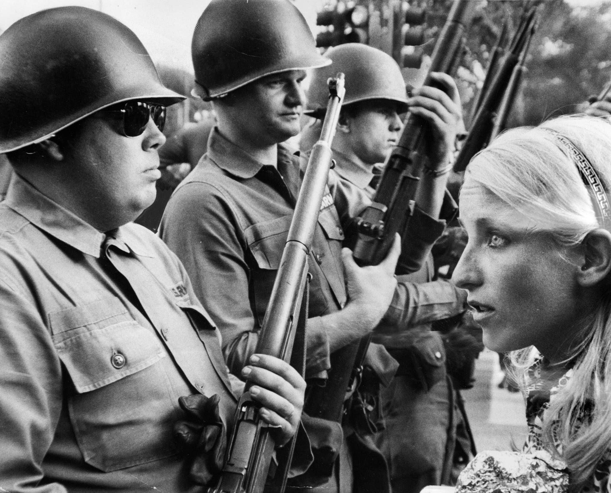 A young anti-war demonstrator confronts National Guardsmen who formed a...