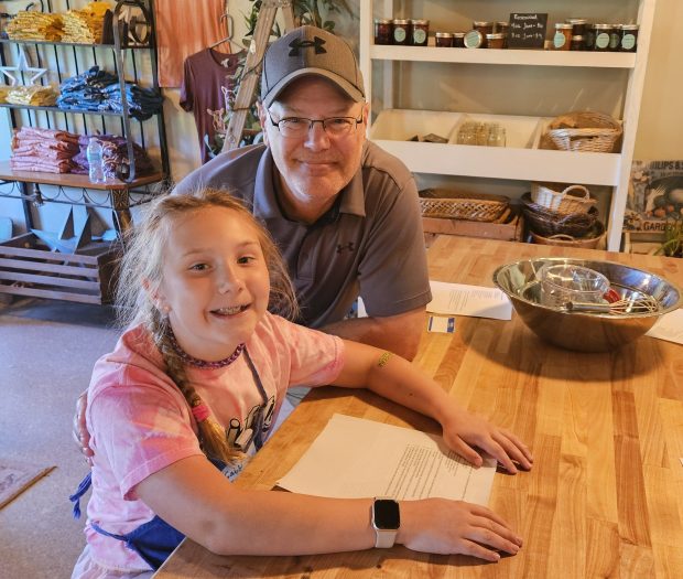 Keith Gaggini of Sugar Grove brought his daughter Gabby, 8, to the kids' Baking Camp this week at Rosewood Farm in Sugar Grove. (David Sharos / For The Beacon-News)