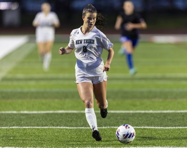 New Trier's Addy Randall (8) sprints down the field before attempting a cross kick against St. Charles North in the Class 3A championship game, at North Central College in Naperville on Saturday, June 1, 2024. (Vincent D. Johnson/for the Beacon-News)