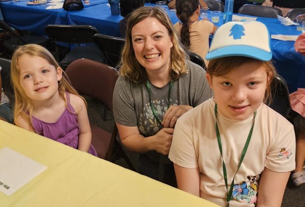 From left, Emilia Jackson, 4, her mother Amy, and sister Lucy, 10, of Aurora all came to Wesley United Methodist Church in Aurora Monday night as part of the annual Art and Soul camp, which runs through Thursday. (David Sharos / For The Beacon-News)