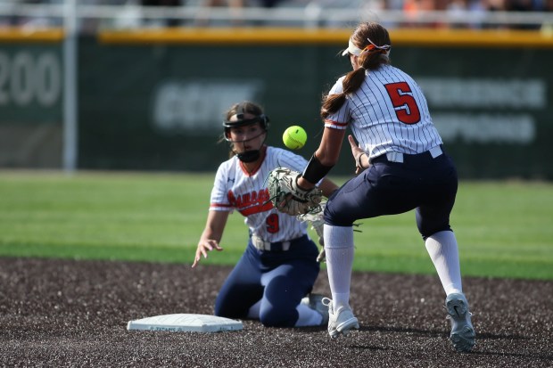 Oswego Short Stop #9 Maddie Hernandez flips the ball to 2nd bace #5 Marissa Moffett to force an out during the Oswego vs. Minooka, Class 4A Illinois Wesleyan Supersectional in Bloomington IL. June 03, 2024 (Daryl Wilson/for the Chicago Tribune)