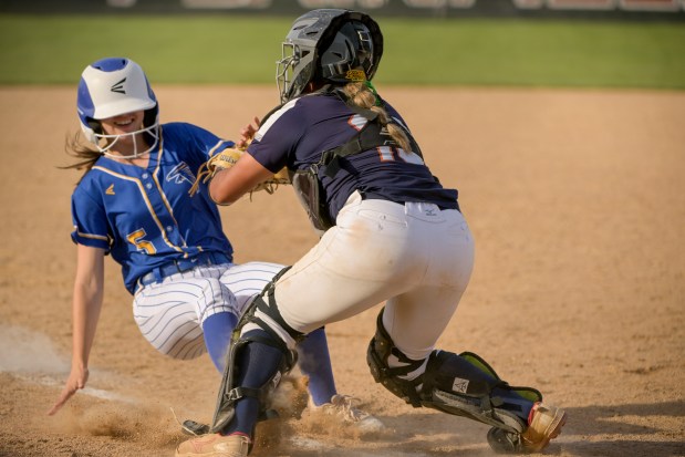 Oswego's Kiyah Chavez (10) makes a game saving out on Wheaton North's Marilyn Alexander (5) at the plate in the bottom of the 7th during the Class 4A Plainfield North Sectional final in Plainfield on Friday, May 31, 2024. (Mark Black / for the Beacon-News)