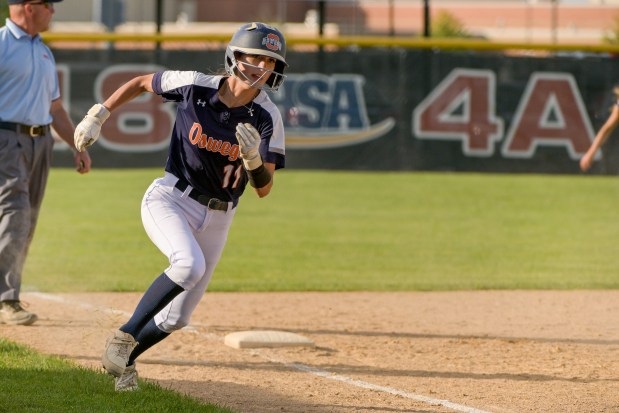 Oswego's Kaylee LaChappell (11) rounds 3rd to score the only run of the game in the 8th inning against Wheaton North on a single by pitcher Jaelynn Anthony during the Class 4A Plainfield North Sectional final in Plainfield on Friday, May 31, 2024. (Mark Black / for the Beacon-News)