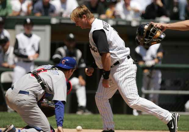 Cubs catcher Michael Barrett, left, and White Sox catcher A.J. Pierzynski get up after a collision at the plate on May 20, 2006, at U.S. Cellular Field. (Phil Velasquez / Chicago Tribune)