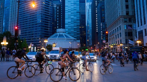 Bikers participate in the annual Naked Bike Ride along State Street on June 9, 2018, in Chicago.(Courtney Pedroza/Chicago Tribune)