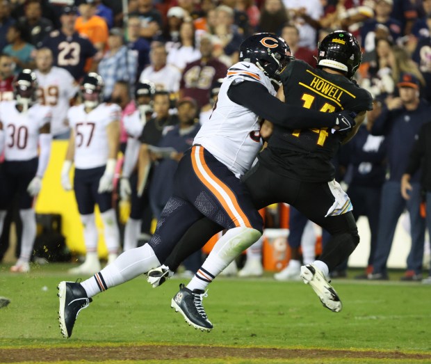 Bears defensive tackle Gervon Dexter Sr. forces Commanders quarterback Sam Howell to throw the ball away in the fourth quarter at FedEx Field on Oct. 5, 2023. (Stacey Wescott/Chicago Tribune)