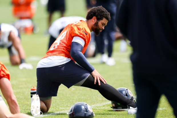 Bears quarterback Caleb Williams stretches during minicamp at Halas Hall on June 5, 2024. (Eileen T. Meslar/Chicago Tribune)