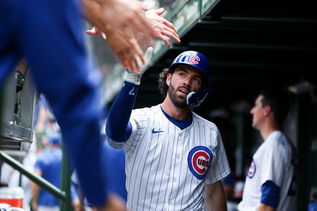 Chicago Cubs shortstop Dansby Swanson (7) celebrates with his teammates after hitting a home run to put the Cubs up 2-0 during the fourth inning against the San Francisco Giants at Wrigley Field on June 19, 2024. (Eileen T. Meslar/Chicago Tribune)