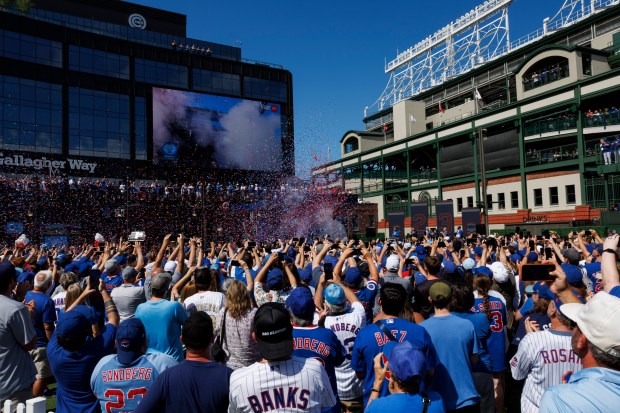 Fans and Cubs players attend a statue dedication ceremony for former Cubs player Ryne Sandberg outside Wrigley Field Sunday June 23, 2024 in Chicago. (Armando L. Sanchez/Chicago Tribune)