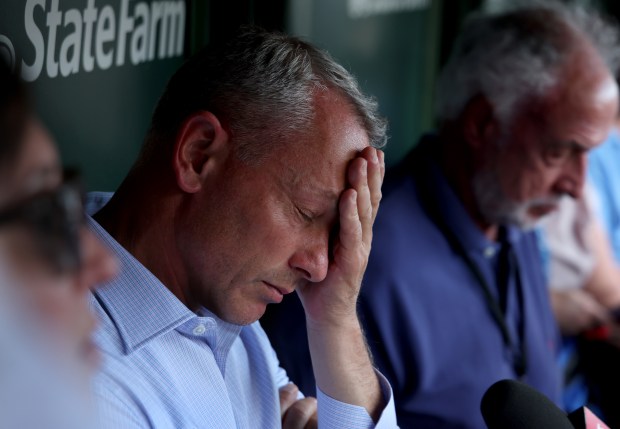 Chicago Cubs general manager Jed Hoyer speaks with the media in the Cubs dugout on a hot and humid 95 degree day before the start of a game between the Chicago Cubs and San Francisco Giants at Wrigley Field on June 16, 2024, in Chicago. (Stacey Wescott/Chicago Tribune)