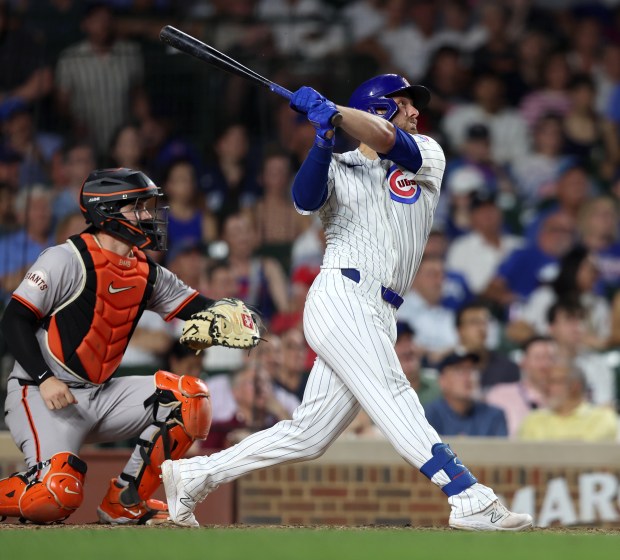 Chicago Cubs first baseman Michael Busch (28) hits a two-run homer in the bottom of the sixth inning against the San Francisco Giants at Wrigley Field on June 17, 2024, in Chicago. (Stacey Wescott/Chicago Tribune)