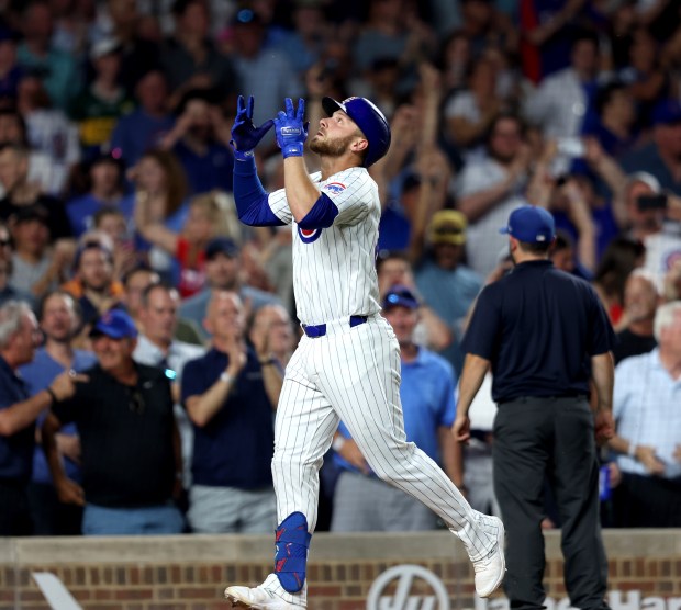 Chicago Cubs first baseman Michael Busch celebrates hitting a two-run homer in the bottom of the sixth inning against the San Francisco Giants at Wrigley Field on June 17, 2024, in Chicago. (Stacey Wescott/Chicago Tribune)