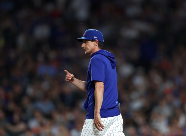 Chicago Cubs head coach Craig Counsell signals to bring in pitcher Hayden Wesneski (19) in the top of the sixth inning against the San Francisco Giants at Wrigley Field on June 17, 2024, in Chicago. (Stacey Wescott/Chicago Tribune)