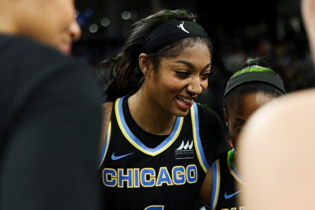 Sky forward Angel Reese (5) smiles in the team huddle after a win over the Indiana Fever on June 23, 2024, at Wintrust Arena. (Eileen T. Meslar/Chicago Tribune)