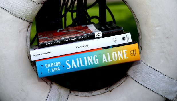 "The Knockout Artist" by Harry Crews, "Farewell, Amethystine" by Walter Mosley and "Sailing Alone" by Richard S. King. (Stacey Wescott/Chicago Tribune)