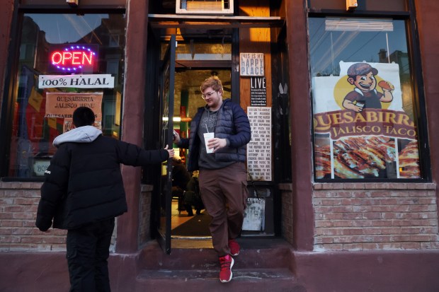 Customers are seen after eating at the restaurant Quesabirria Jalisco on W. 18th Street in Chicago on March 20, 2024. (Terrence Antonio James/Chicago Tribune)