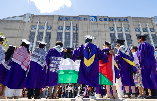 Several dozen graduates and supporters gather outside after walking out in support of the Palestinians during Northwestern University's commencement on June 9, 2024, at the United Center. (Brian Cassella/Chicago Tribune)