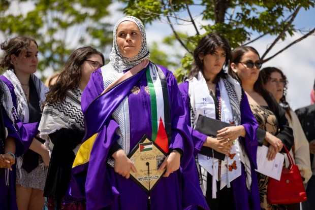 Several dozen graduates and supporters gather outside for Palestinian victims of the war in Gaza after walking out in protest during Northwestern University's commencement on June 9, 2024, at the United Center. (Brian Cassella/Chicago Tribune)