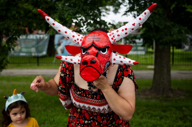 A parade attendee displays a traditional Vejigante mask in the style of the Chicago Bulls during the 46th Puerto Rican People's Day Parade on June 8, 2024, in Humboldt Park in Chicago. (Vincent Alban/Chicago Tribune)