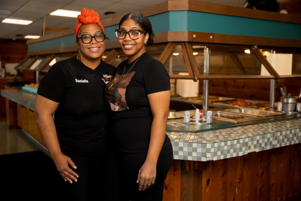 Daniella Coffey, left, the owner of St. Rest #2 Country Kitchen, poses for a portrait with her niece, Angela Chapman, the general manager, on June 7, 2024, at the restaurant in Chicago. (Vincent Alban/Chicago Tribune)