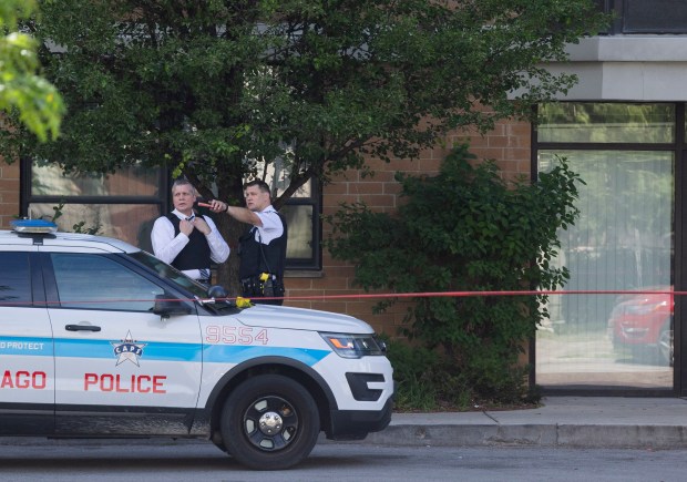 Chicago police work at the Oakley Square apartment complex on June 18, 2024, where 7-year-old Jaimani Amir Rivera was shot and killed. (Vincent Alban/Chicago Tribune)