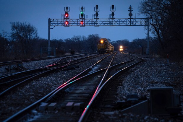 Freight trains wait for a Metra train to pass at a choke point on the Belt Junction on Dec. 11, 2023. (E. Jason Wambsgans/Chicago Tribune)