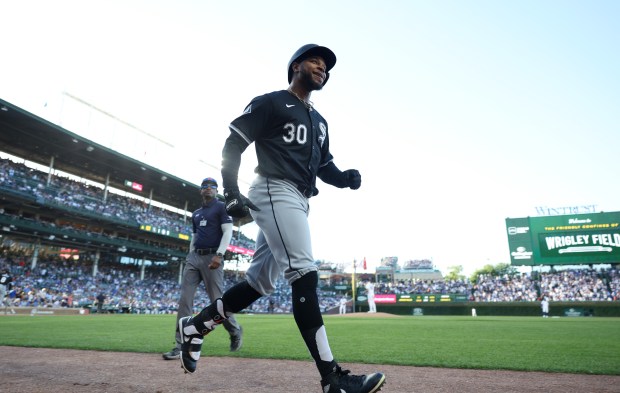 White Sox left fielder Corey Julks (30) heads to the dugout after hitting a home run on the first pitch of the game against the Cubs at Wrigley Field on June 5, 2024, in Chicago. (John J. Kim/Chicago Tribune)