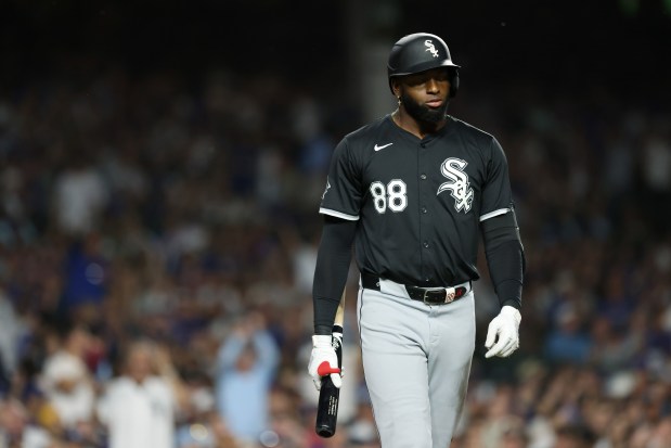 White Sox center fielder Luis Robert Jr. heads to the dugout after striking out swinging in the ninth inning against the Cubs on June 5, 2024, at Wrigley Field. (John J. Kim/Chicago Tribune)