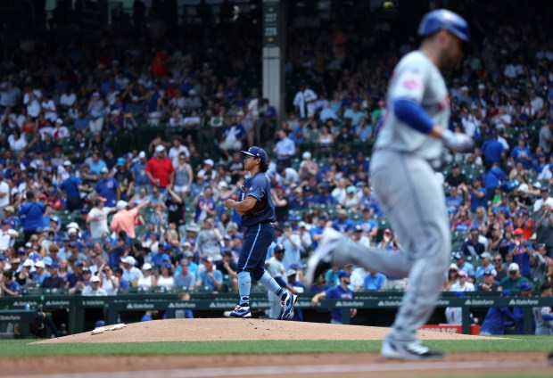 Chicago Cubs pitcher Shota Imanaga stands on the mound as New York Mets designated hitter J.D. Martinez rounds the bases after hitting a 3-run home run in the first inning of a game at Wrigley Field in Chicago on June 21, 2024. (Chris Sweda/Chicago Tribune)