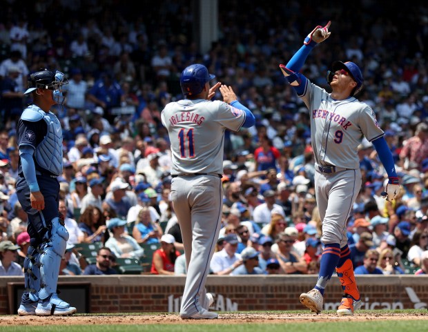 New York Mets left fielder Brandon Nimmo (9) celebrates after hitting a 2-run home run in the second inning of a game against the Chicago Cubs at Wrigley Field in Chicago on June 21, 2024. (Chris Sweda/Chicago Tribune)