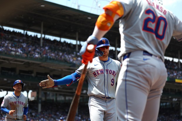 New York Mets left fielder Brandon Nimmo (9) celebrates after hitting a 2-run home run in the second inning of a game against the Chicago Cubs at Wrigley Field in Chicago on June 21, 2024. (Chris Sweda/Chicago Tribune)