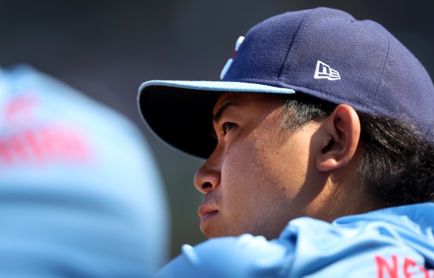 Chicago Cubs starting pitcher Shota Imanaga stands in the dugout in the 8th inning of a game against the New York Mets at Wrigley Field in Chicago on June 21, 2024. (Chris Sweda/Chicago Tribune)
