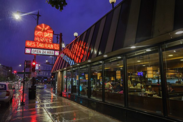 Rain falls at 12:06 a.m. outside of the Golden Apple Grille & Breakfast House in Chicago's Lakeview neighborhood on June 23, 2024. (Chris Sweda/Chicago Tribune)