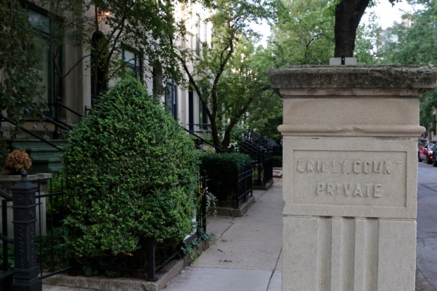 A historic marker shows Crilly Court on the block where the Henry Gerber House is located at 1710 N. Crilly Court in Chicago on June 6, 2024. Gerber, who founded the Society for Human Rights, lived in this house which is on the National Historic Registe. (Antonio Perez/Chicago Tribune)