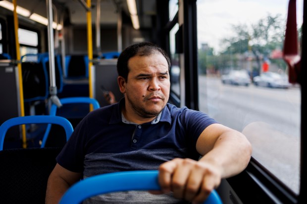 Jose Antuna, 40, from Venezuela, rides the bus on South Western Avenue while going to physical therapy on June 18, 2024, in Chicago. (Armando L. Sanchez/Chicago Tribune)