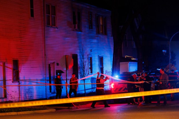 Officers work the scene where multiple people were shot near the 5200 block of South Damen Avenue on April 13, 2024, in Chicago. (Armando L. Sanchez/Chicago Tribune)