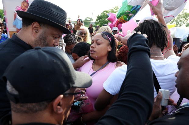 Raven Adams, center, attends a memorial on May 31, 2024, days after her daughter Reign Ware, 5, was fatally shot. (Terrence Antonio James/Chicago Tribune)