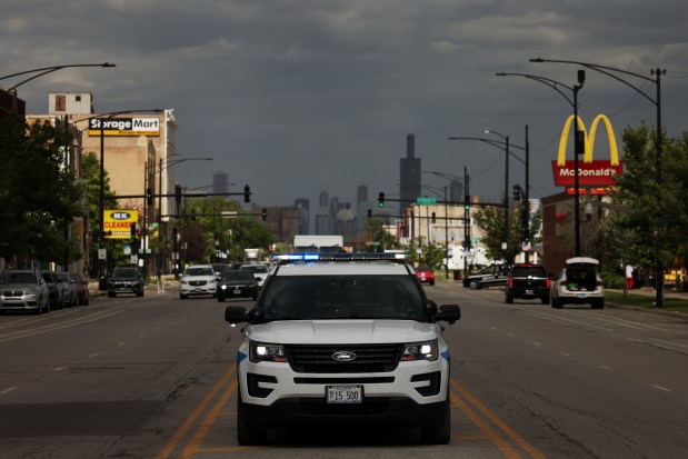 A police SUV is parked on the median in the 5000 block of West Madison Street on June 6, 2024, in Chicago. (John J. Kim/Chicago Tribune)