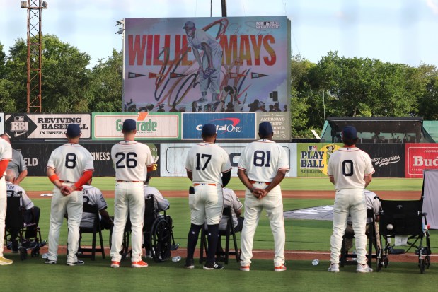 Players pause to honor Willie Mays before the start of a the game between the Cardinals and the Giants at Rickwood Field on June 20, 2024, in Birmingham, Ala. (AP Photo/Vasha Hunt)