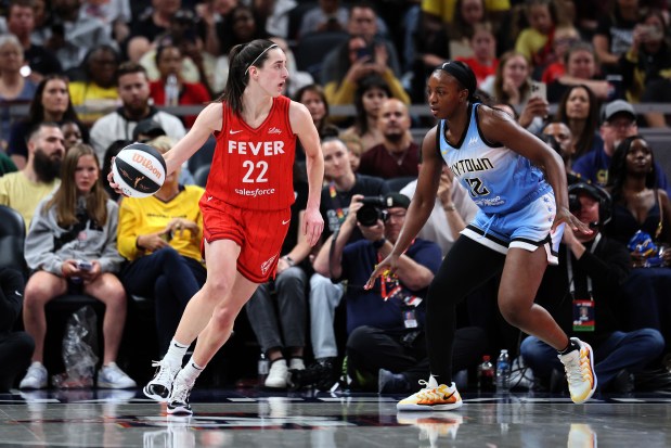 Caitlin Clark #22 of the Indiana Fever dribbles against Michaela Onyenwere #12 of the Chicago Sky during the third quarter in the game at Gainbridge Fieldhouse on June 01, 2024 in Indianapolis, Indiana. NOTE TO USER: User expressly acknowledges and agrees that, by downloading and or using this photograph, User is consenting to the terms and conditions of the Getty Images License Agreement. (Photo by Andy Lyons/Getty Images)