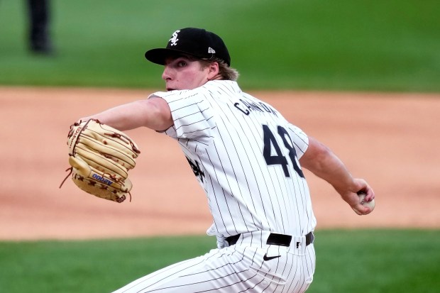 Chicago White Sox starting pitcher Jonathan Cannon winds up during the first inning of the team's baseball game against the Houston Astros on Tuesday, June 18, 2024, in Chicago. (AP Photo/Charles Rex Arbogast)