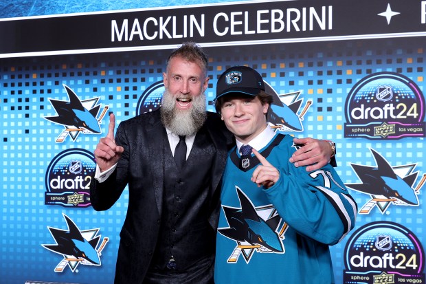 Macklin Celebrini, right, poses with Joe Thornton after the Sharks selected him with the No. 1 pick in the NHL draft on June 28, 2024, at Sphere in Las Vegas. (Ethan Miller/Getty)