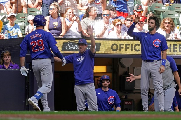 Cubs first baseman Michael Busch (29) is congratulated by manager Craig Counsell after hitting a two-run home run during the first inning against the Brewers on June 29, 2024, in Milwaukee. (Aaron Gash/AP)